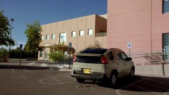 Exterior shot of the school, followed by Walt in the classroom.