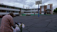 Hank takes Walt Jr. to a motel parking lot.