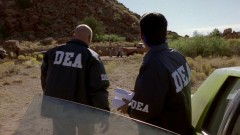 The DEA examines the cook site and the abandoned car.