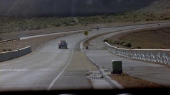 Walt drives on an empty road.