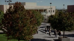 Exterior shot of the school, followed by Walt Jr. in Walt's class.