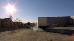 A truck takes away the barrel of corrosive material.

This was shot directly behind Saul's office exterior.