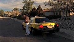 Walt takes a cab to his house.