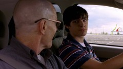 Walt is teaching Walt Jr. to drive.