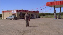 Hank drives to a gas station.