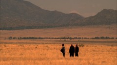 Gus, Mike, and Jesse wait for a plane in the desert.