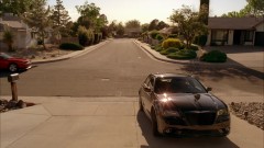 Walt and Walt Jr. arrive at home in their new cars.