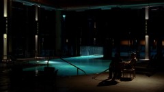 Walt talks to his son at the hotel pool.
