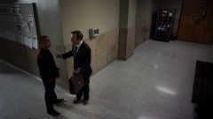 Saul talks to a client.