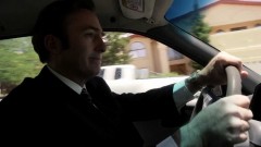 Saul drives through town.