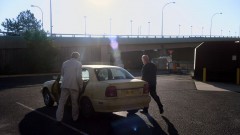 Mike and Saul walk to Saul's car.