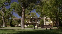 Saul and Chuck sit on a bench outside Chuck's house.