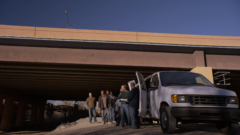 Saul and the other arrive under a bridge