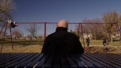 Mike and his granddaughter are at a playground
