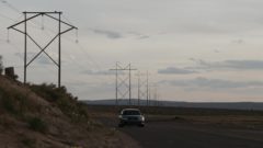 Kim is driving through the desert