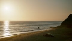 Howard's car is abandoned at the beach