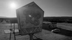 Francesca arrives at an abandoned gas station